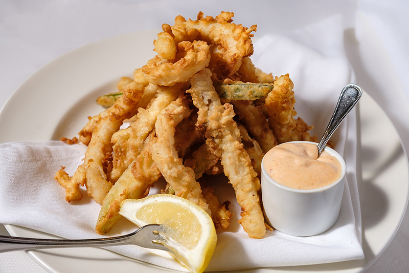 Picture of deep fried French Fries and Shrimp served with lemon and zesty sauce at Bass Street Chop House